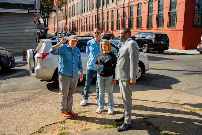 A Kensington resident (left) speaks with Councilmembers Jim Harrity, Quetcy Lozada and Council President Kenyatta Johnson.